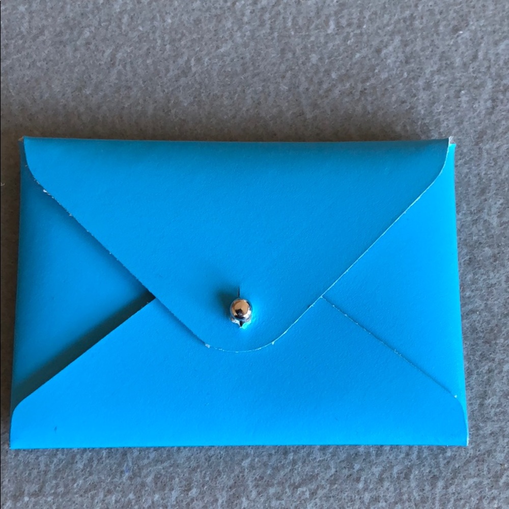“Paper thinks” leather business card holder